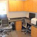 Picture of the receptionists' desks. in {PRACTICE_NAME}